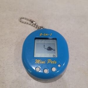 Vintage Zoo Zone 8 In 1 Mini Pets Electronic Tamagotchi Keychain Blue